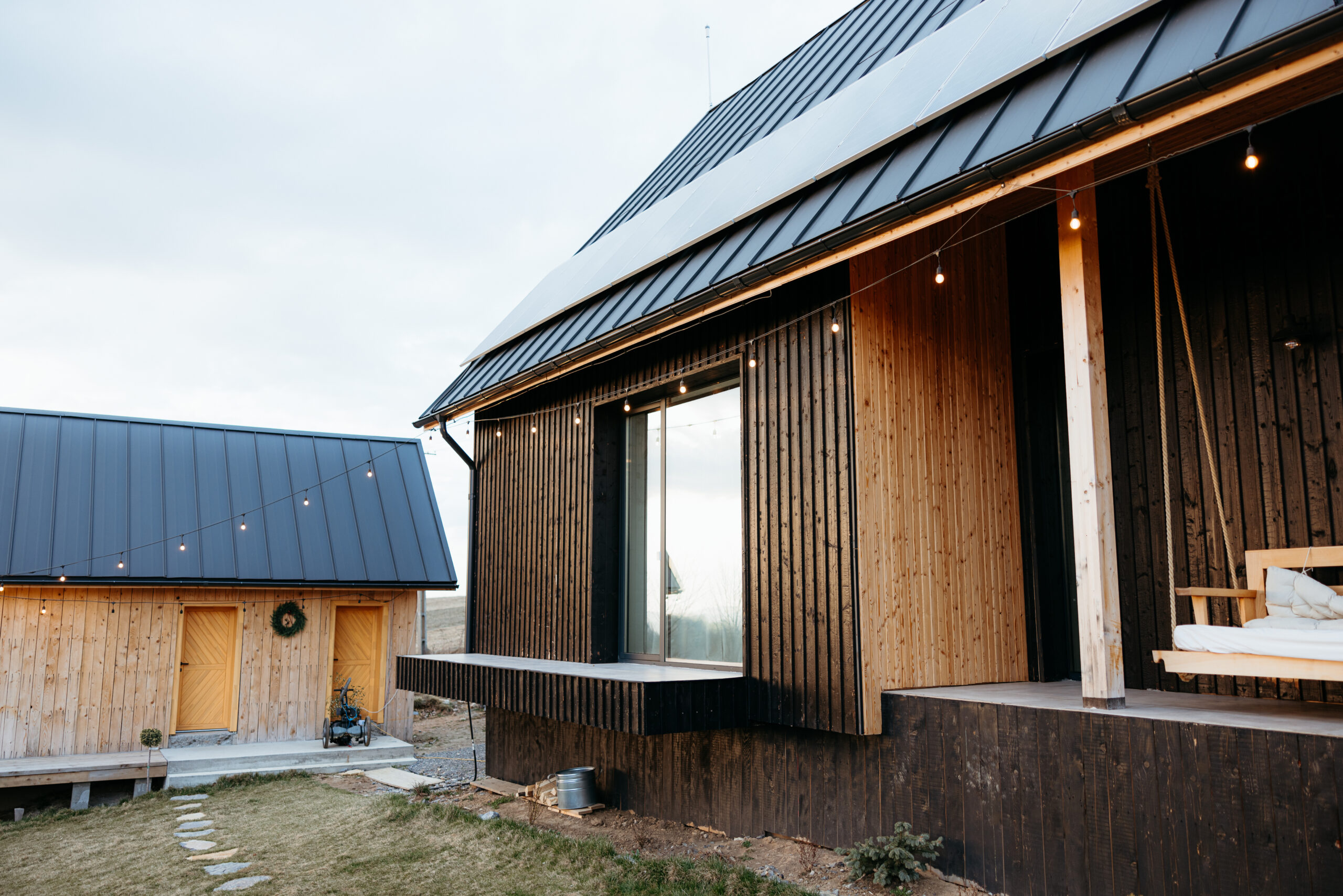 Modern off-grid cabin with rooftop solar panels in the Australian bush