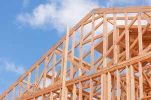 Timber-frame home under construction, illustrating construction loan interest during the build