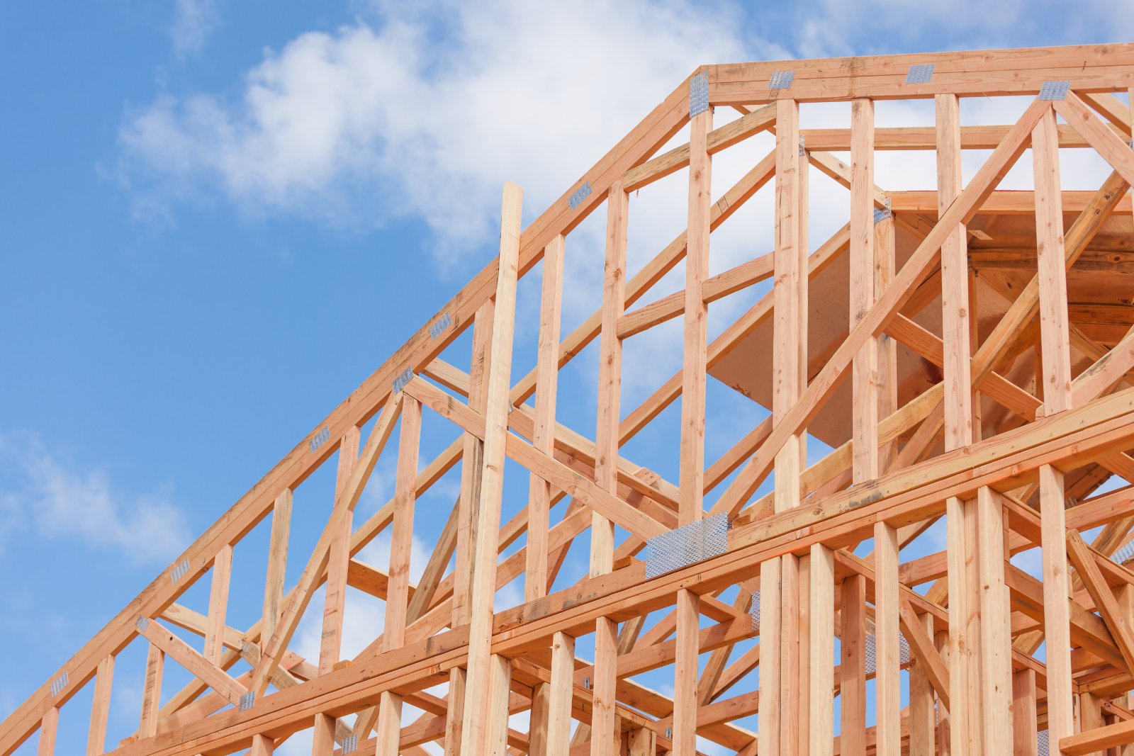 Timber-frame home under construction, illustrating construction loan interest during the build