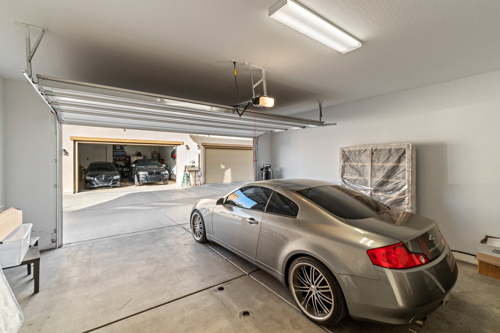 Double garage with a car, the space for a garage conversion