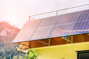 Solar panels on the roof of a small off-grid home