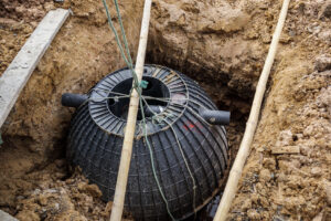 Septic tank being installed in an excavated pit